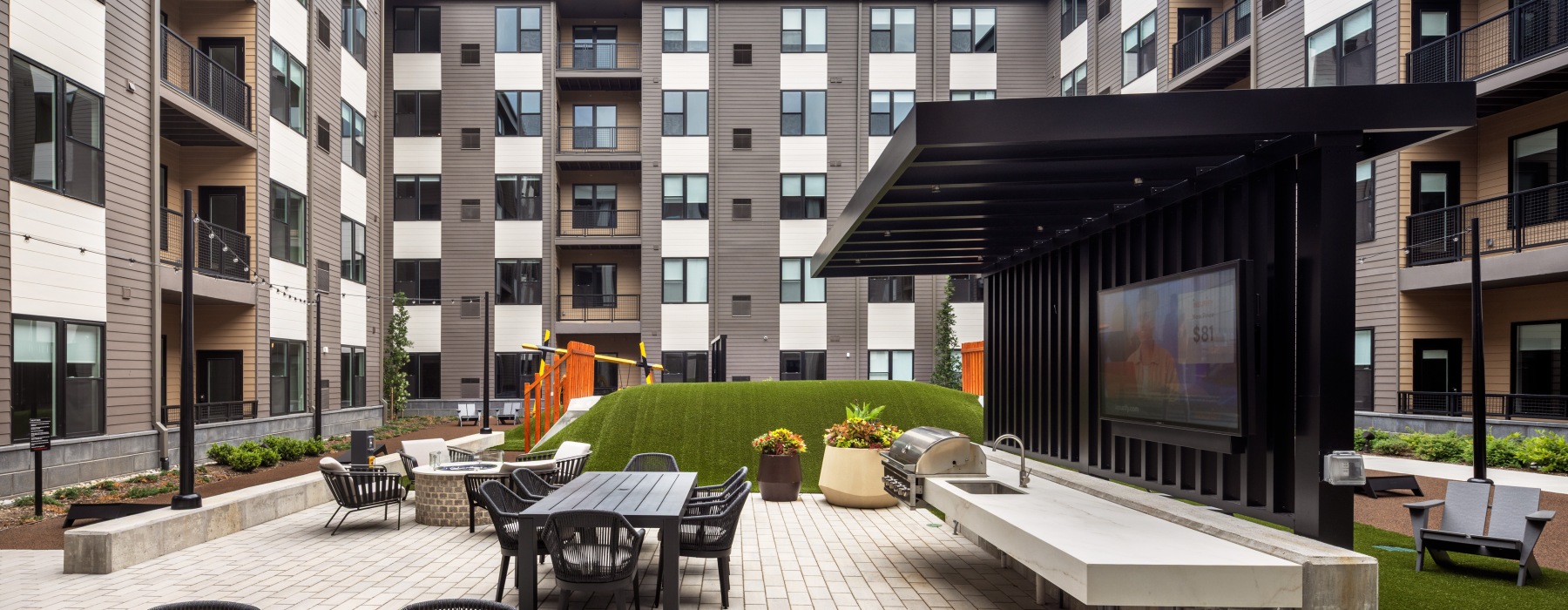 outdoor area with seating and a grill